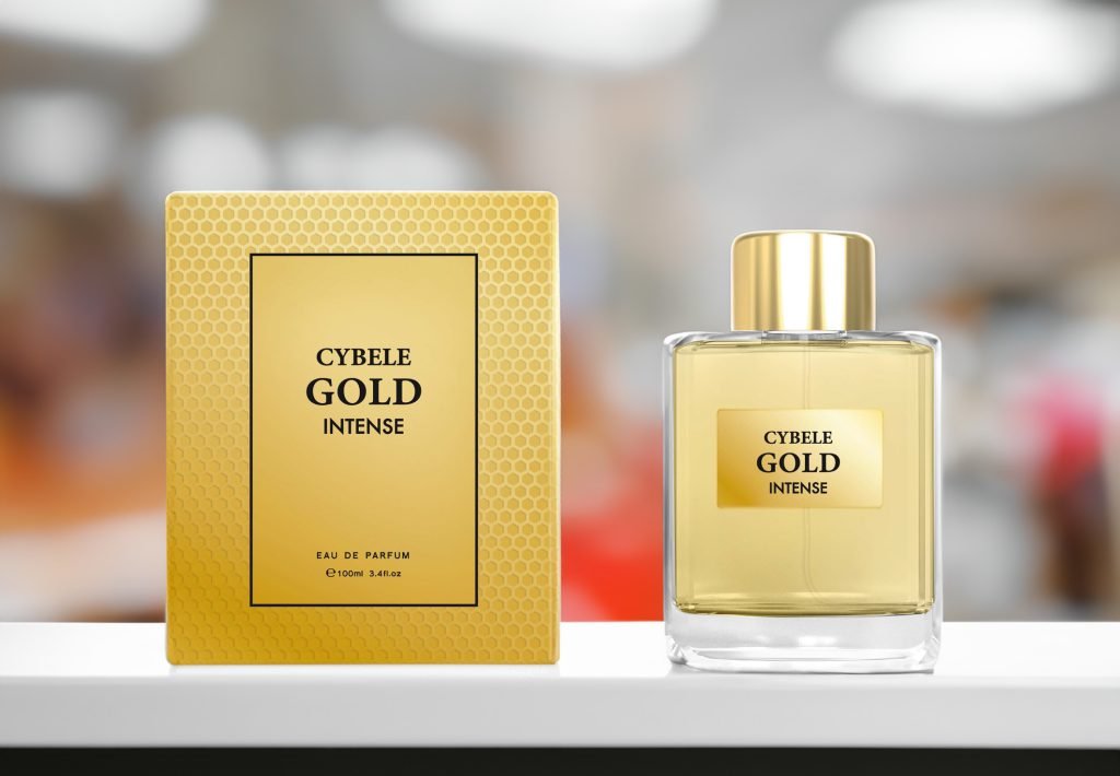 Cybele Gold Intense from signature by cybele on a white platform with the box to the left | Cybele Gold perfume