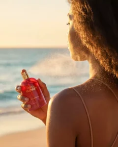 a lady spraying the happy flower perfume by Signature by Cybele